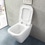Immagine di Ideal Standard TONIC II vaso a pavimento filo parete AquaBlade®, completo di sedile slim a sgancio rapido, colore bianco K317201
