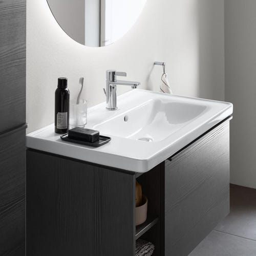 Immagine di Duravit D-NEO composizione bagno: mobile sottolavabo e colonna sospesi, finitura rovere nero + specchio Ø 90 con illuminazione, versione "Good" + lavabo 80 cm, colore bianco + miscelatore monocomando M, finitura cromo DE425701616+DE1318L1616