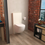 Immagine di SFA Sanitrit SANICOMPACT COMFORT+ APPLIQUE wc sospeso, con trituratore integrato e collegamento lavabo, con rivestimento bianco CPTCOMFORT+APP