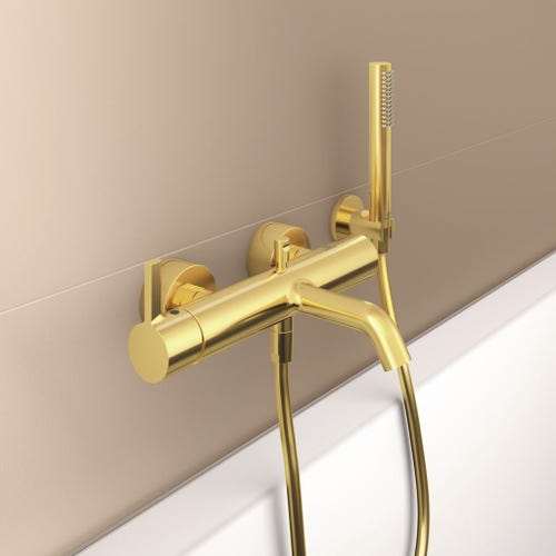 Immagine di Ideal Standard JOY miscelatore monocomando esterno per vasca/doccia, con doccetta a 1 funzione, supporto fisso a muro e flessibile 160 cm, finitura brushed gold BC787A2