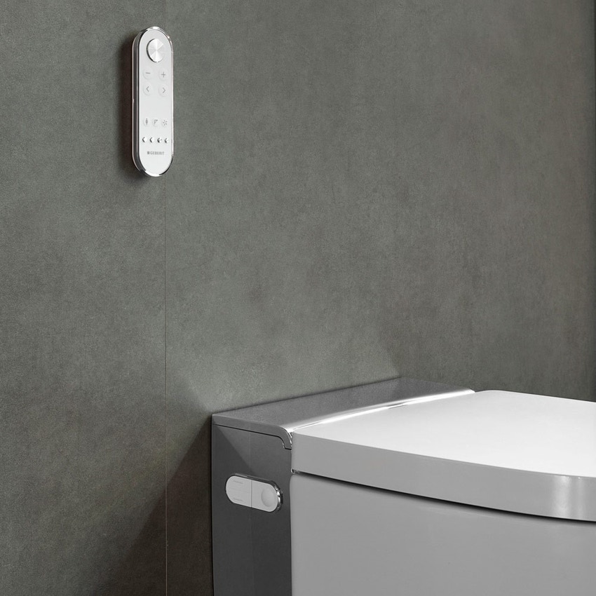 Immagine di Geberit AQUACLEAN MERA COMFORT vaso sospeso, senza brida, completo di sedile con funzione bidet a chiusura ammortizzata e cover cromo lucido, colore bianco finitura lucido 146.210.21.1