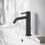 Immagine di Ideal Standard CERALINE miscelatore monocomando H.19 cm per lavabo, con asta di comando e scarico piletta da 1-1/4", con sistema BlueStart, colore nero finitura opaco BD761XG
