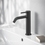 Immagine di Ideal Standard CERALINE miscelatore monocomando H.19 cm per lavabo, senza asta di comando e scarico piletta, con sistema BlueStart, colore nero finitura opaco BD760XG