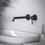 Immagine di Ideal Standard CERALINE miscelatore monocomando P.23 cm per lavabo, a parete, senza corpo incasso, colore nero finitura opaco BD848XG
