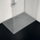 Immagine di Ideal Standard ULTRA FLAT S I.LIFE piatto doccia rettangolare L.180 P.90 cm, antiscivolo e con scarico nascosto sul lato lungo, in IdealSolid+, effetto pietra, colore grigio cemento finitura opaco T5230FS