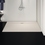 Immagine di Ideal Standard ULTRA FLAT S I.LIFE piatto doccia rettangolare L.180 P.90 cm, antiscivolo e con scarico nascosto sul lato lungo, in IdealSolid+, effetto pietra, colore sabbia finitura opaco T5230FT