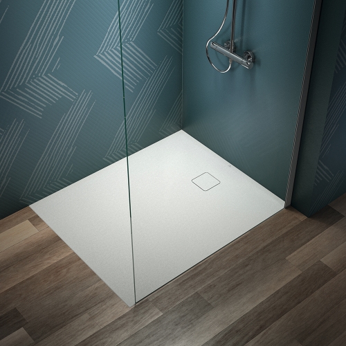 Immagine di Ideal Standard ULTRA FLAT EVO piatto doccia rettangolare L.120 P.100 cm, installazione sopra pavimento o filo pavimento, in StoneTech, antiscivolo, con scarico sul lato corto, colore bianco seta finitura opaco T5437FO