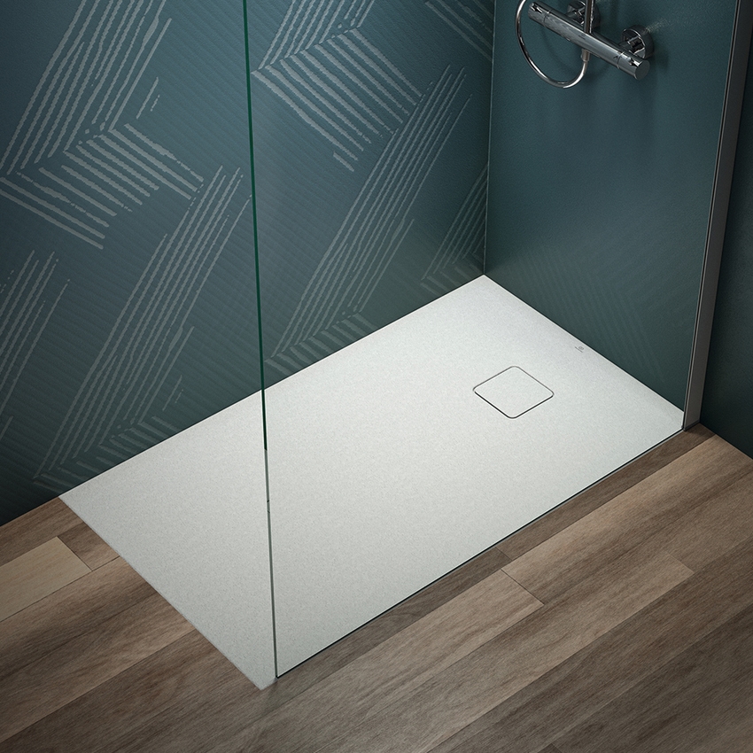 Immagine di Ideal Standard ULTRA FLAT EVO piatto doccia rettangolare L.120 P.70 cm, installazione sopra pavimento o filo pavimento, in StoneTech, antiscivolo, con scarico sul lato corto, colore bianco seta finitura opaco T5440FO
