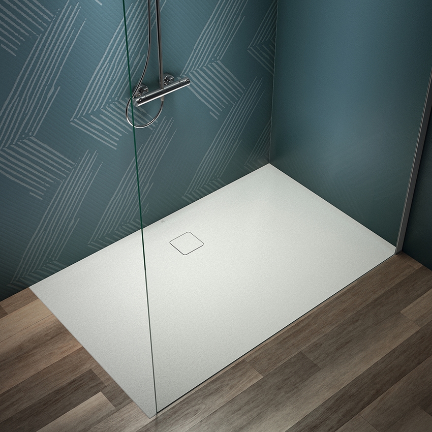 Immagine di Ideal Standard ULTRA FLAT EVO piatto doccia rettangolare L.160 P.100 cm, installazione sopra pavimento o filo pavimento, in StoneTech, antiscivolo, con scarico sul lato lungo, colore bianco seta finitura opaco T5533FO