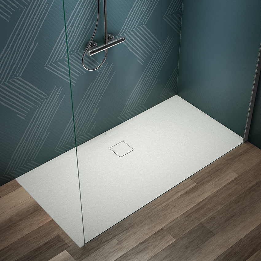 Immagine di Ideal Standard ULTRA FLAT EVO piatto doccia rettangolare L.160 P.80 cm, installazione sopra pavimento o filo pavimento, in StoneTech, antiscivolo, con scarico sul lato lungo, colore bianco seta finitura opaco T5433FO
