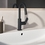 Immagine di Ideal Standard CERALIFE C miscelatore monocomando per lavabo, con doccetta estraibile, con piletta click-clack, colore nero finitura opaco BE056XG