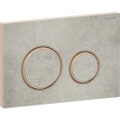 Immagine di Geberit SIGMA50 placca di comando per risciacquo a due quantità, piastra base e anelli di design finitura oro rosso, placca di copertura e tasti finitura effetto cemento 115.650.JV.1