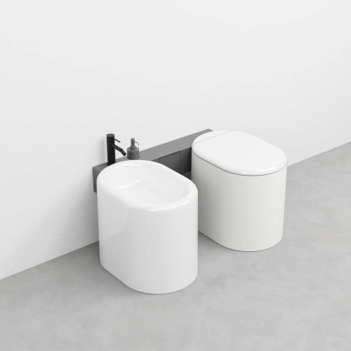 Immagine di Cielo ITACA mensola per wc e bidet in acciaio inox, senza foro rubinetto, alloggio dispenser e portarotolo, versione sinistra, colore cemento finitura opaco ITMBWSXSFCM