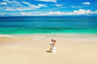 Honeymoon couple on the beach