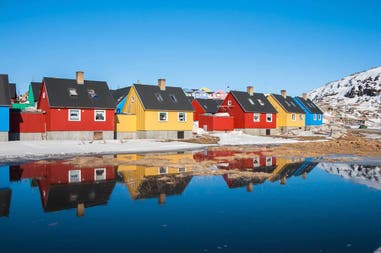 Colourful houses reflected over the lake in Greenland