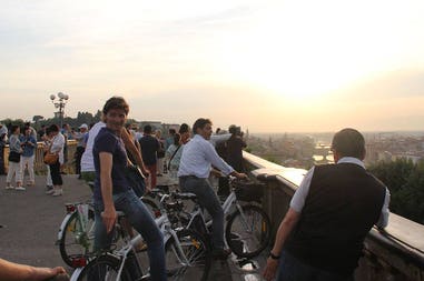 Group people discover Florence by bike