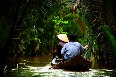 People padding in Mekong Delta River in Vietnam