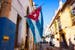 Flag in a typic street of Cuba