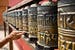 man-spins-prayer-wheels