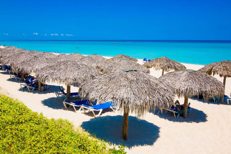 Umbrellas on a white sandy beach in Cuba