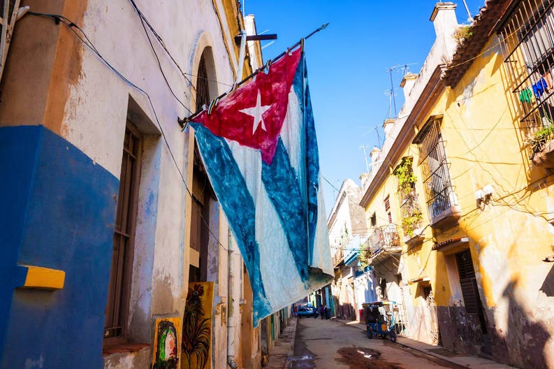 Flag in a typic street of Cuba