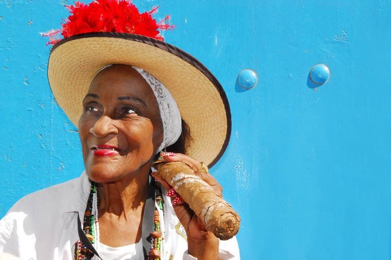 Woman smoking a cigar in Cuba