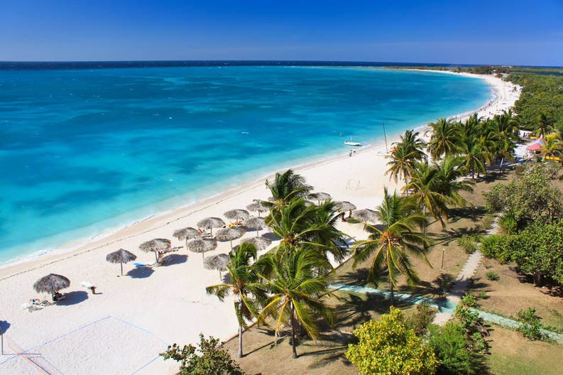 White sandy beach and crystal-clear sea in Cuba