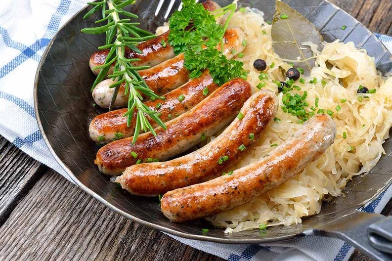 munich-bavarian-fried-sausages-on-sauerkraut