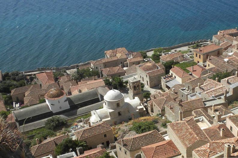 View of a typical town and the crystal-clear sea in Greece