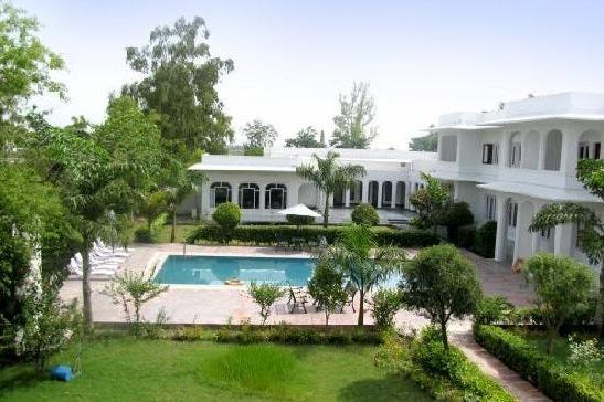 Swimming pool of the Udai Vilas Palace Hotel in Bharatpur in India