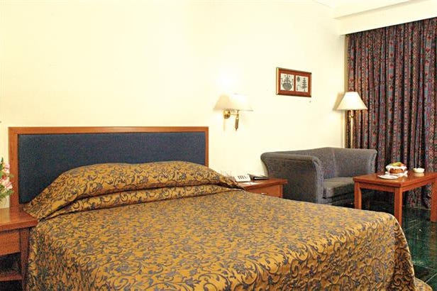 Camera da letto del GRT Regency a Madurai in India