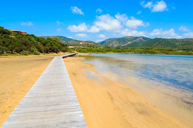 Wooden walkway in Chia in Sardinia in Italy
