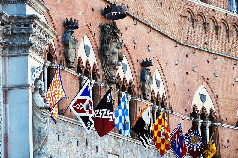 Contradas' flags in Siena in Italy