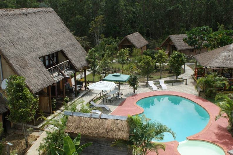 View from above of the swimming pool and some bungalow of the Grace Lodge in Andasibe in Madagascar