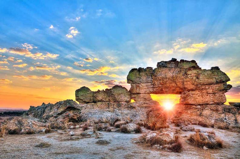 Sunset over a stone arch in Madagascar