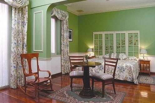 Bedroom of the hotel La Casona in Mexico City