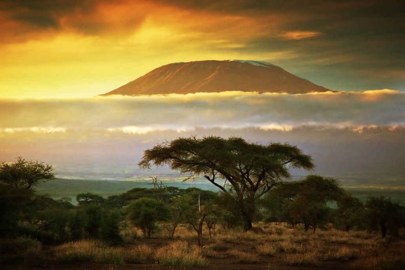 tanzania-mount-kilimanjaro-and-clouds-line-at-sunse